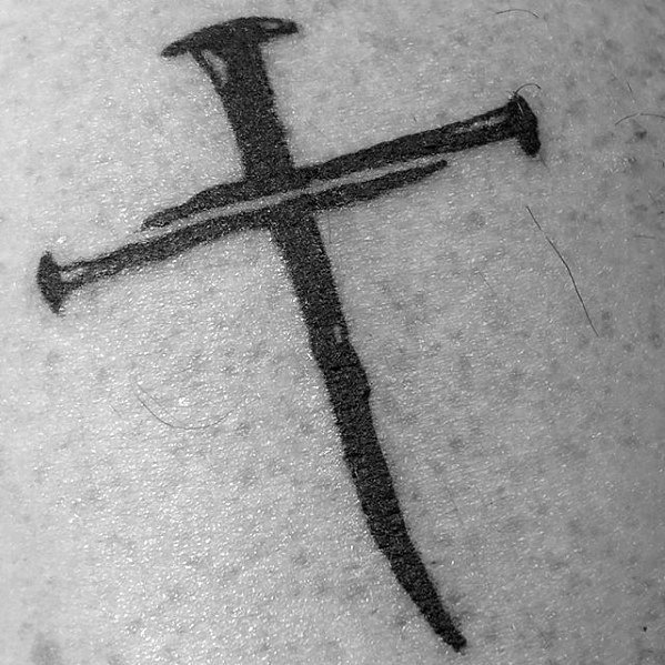 Tattoo of a cross made from two intersecting nails