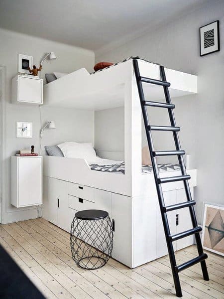 Modern bunk bed with storage drawers, ladder, and a round bunk bedside stool in a bright room
