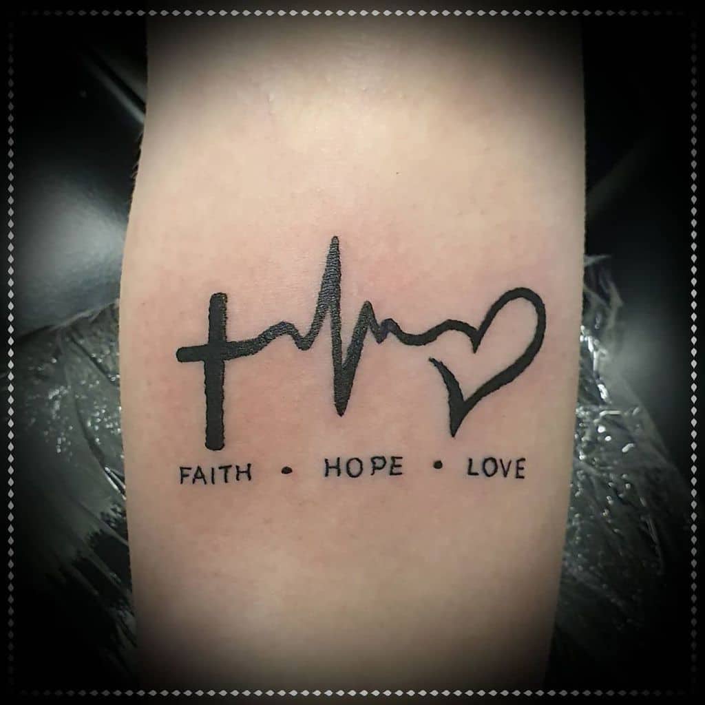 Tattoo features a cross, heartbeat, and heart, with the inspiring words "Faith • Hope • Love" elegantly scripted below