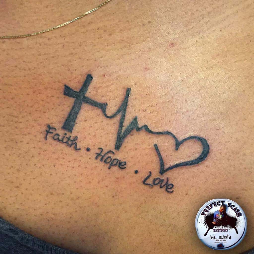 A tattoo features a cross entwined with a heartbeat line and heart, embodying the words "Faith, Hope, Love" on skin