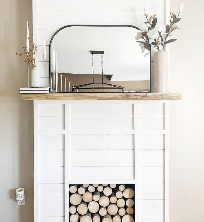 simple faux fireplace surround black accent mirror