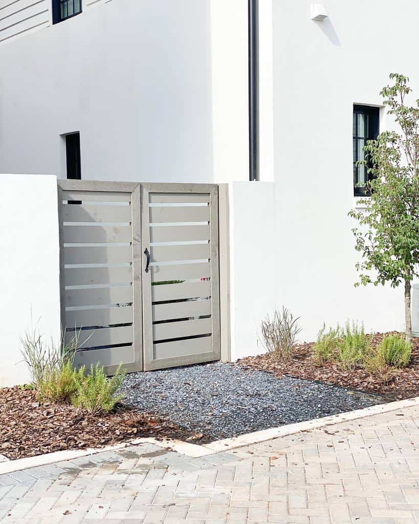 simple gray wood panel garden gate backyard