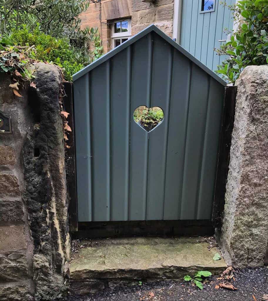 simple wood garden gate with heart shape cutout