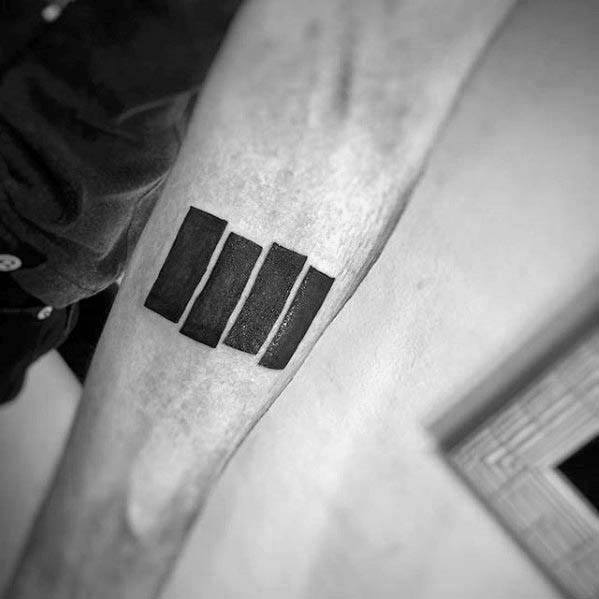 Classic Black Flag bars tattooed on the inner forearm, angled for dynamic visual impact and a nod to raw punk authenticity.
