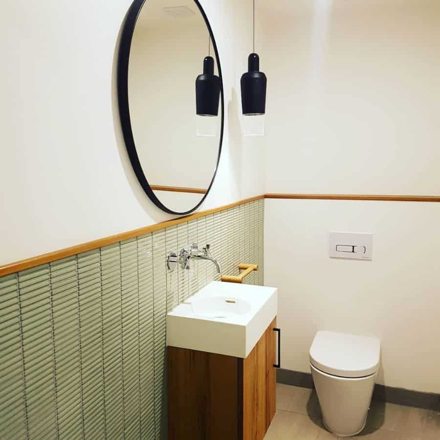 minimalist powder room with small sink and toilet 