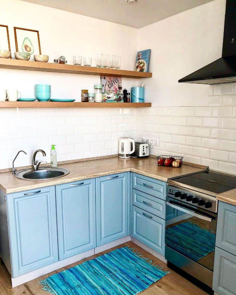 simple corner kitchenette blue cabinets