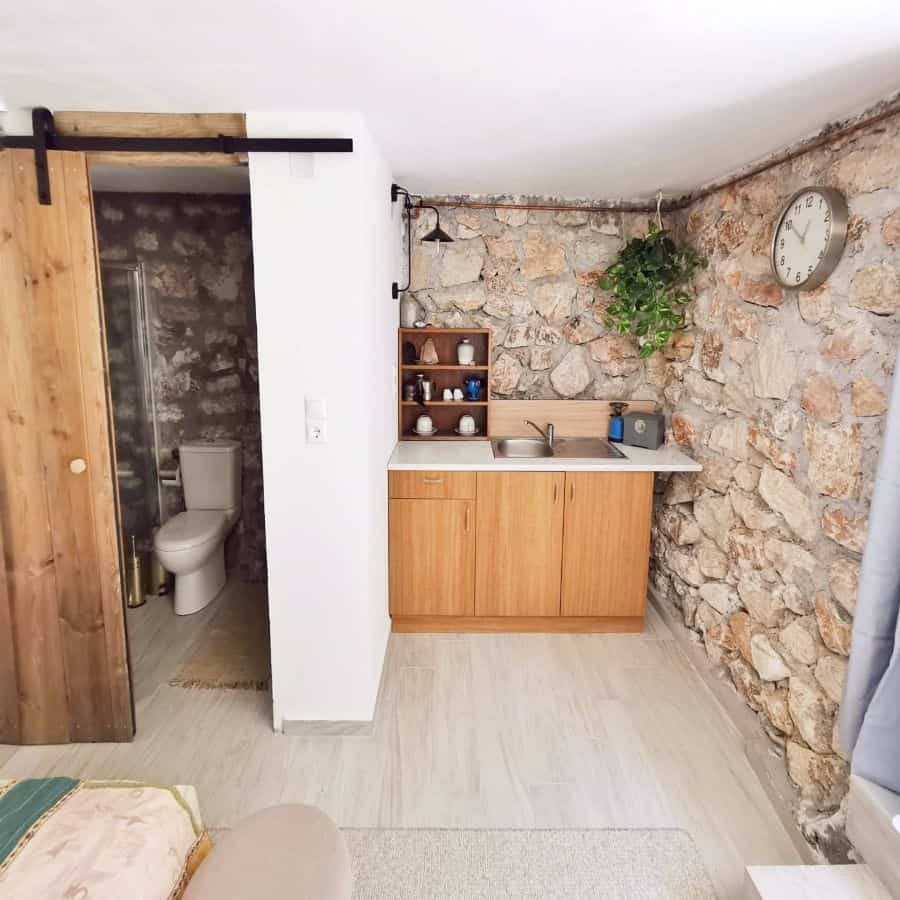 simple kitchenette stone wall ensuite bathroom