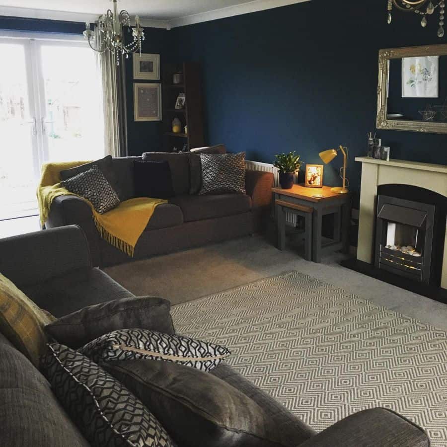 simple modern living room two couches fireplace wall mirror 