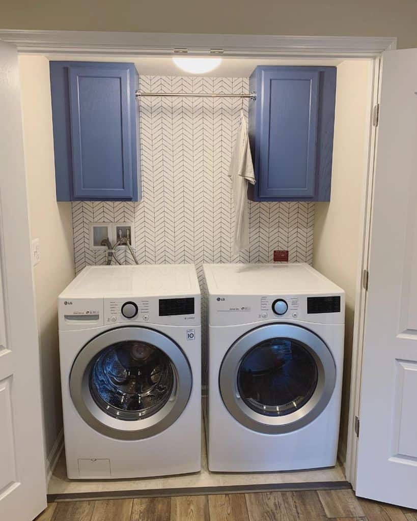 blue wall cabinet laundry washer and dryer