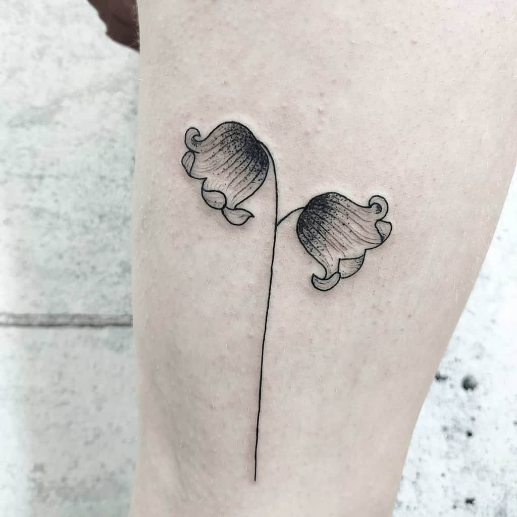 Minimalist Lily of the Valley tattoo featuring two delicate bell-shaped flowers with fine shading and a single thin stem for an elegant look