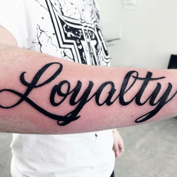 Simple Loyalty Mens Cursive Tattoos On Outer Forearms