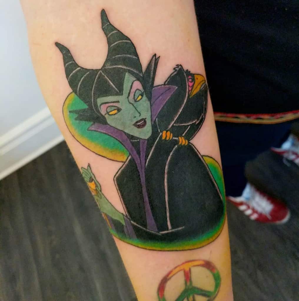 Classic Maleficent tattoo with bold outlines and vibrant colors, capturing the iconic villain’s sinister charm with a nostalgic animated touch