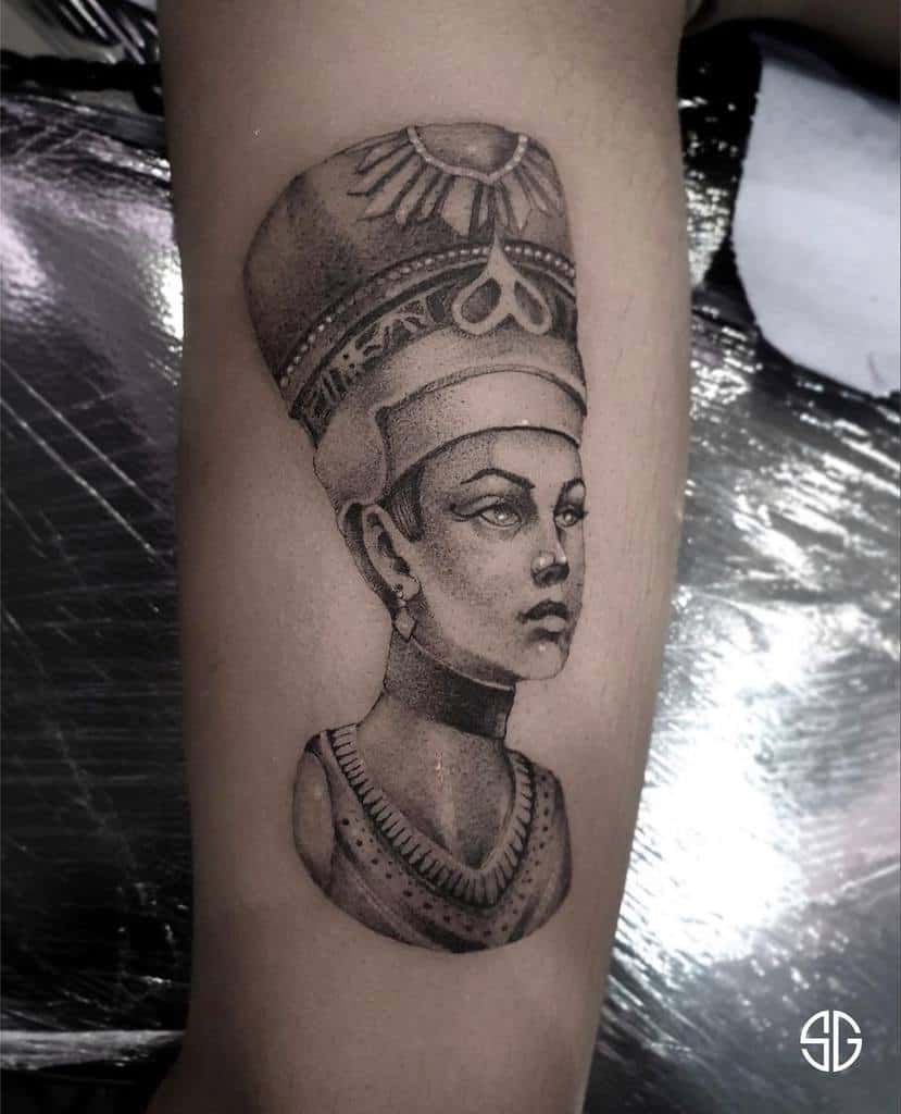 Black and white tattoo of an Egyptian queen on an arm
