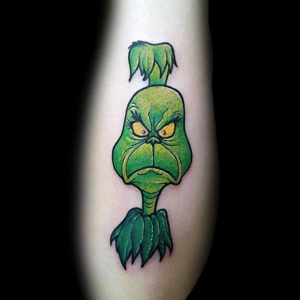 Grinch character with an angry expression, highlighted in vibrant green with bold black lines and yellow eyes, creating a playful and dynamic tattoo design.