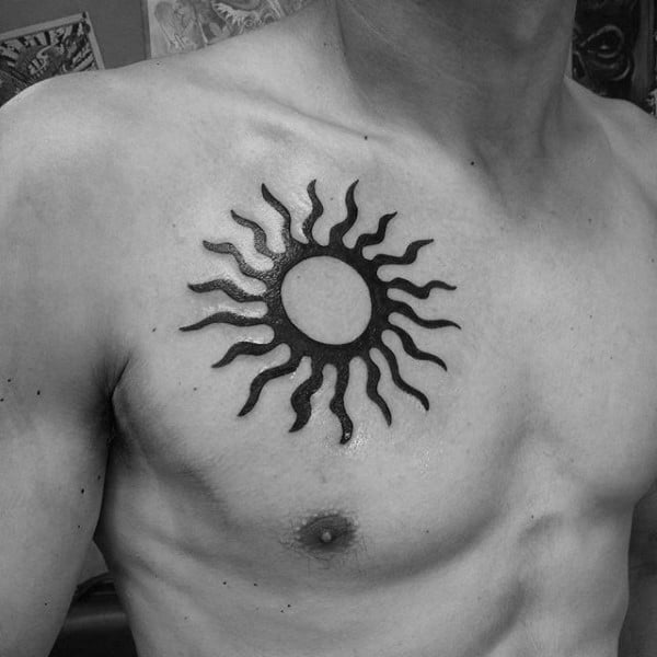Simple Small Upper Chest Tribal Sun Black Ink Guys Tattoos