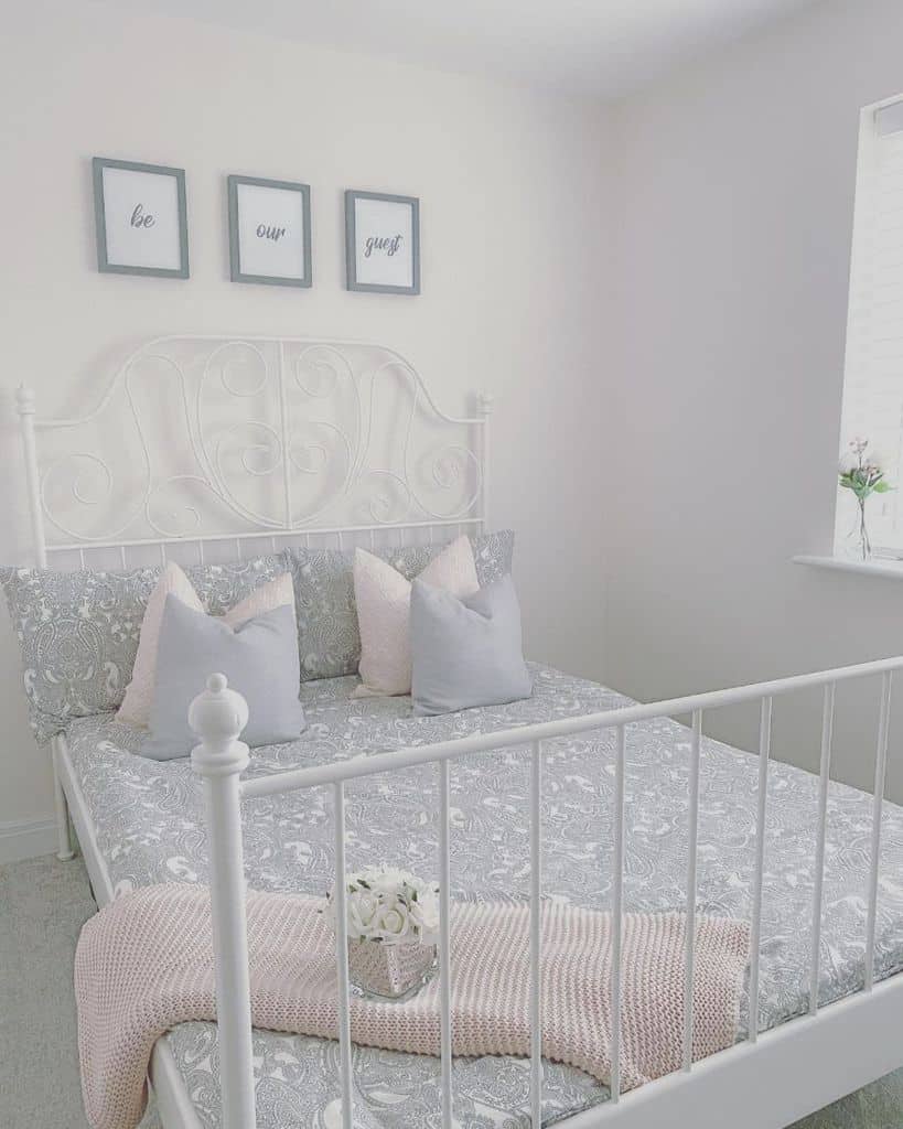 white vintage bed frame in spare bedroom 