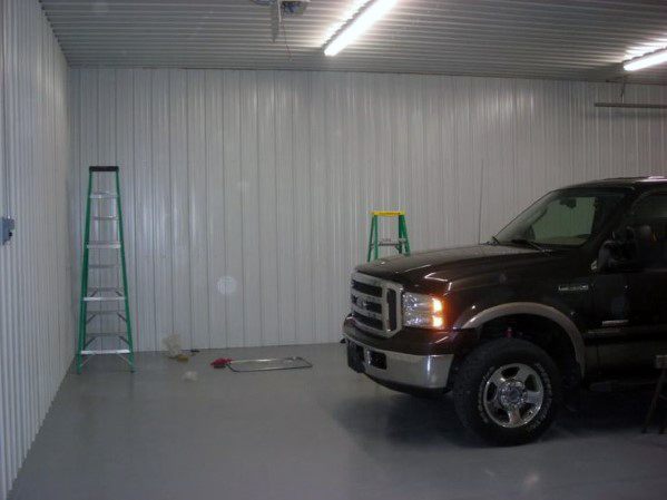 simple steel panel garage polished concrete floor suv