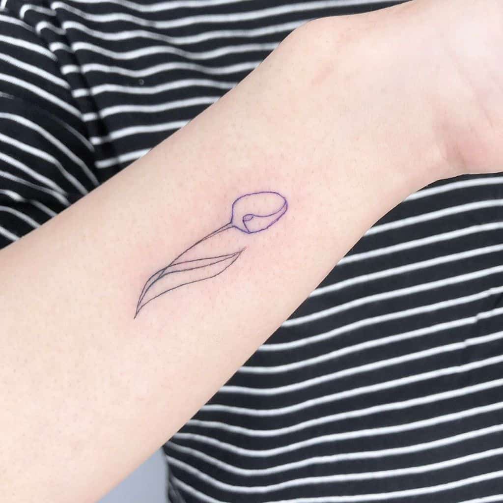 A simple outline of a tulip tattoo on the forearm, with clean lines and a purple hue, featuring a single leaf and delicate flower shape.