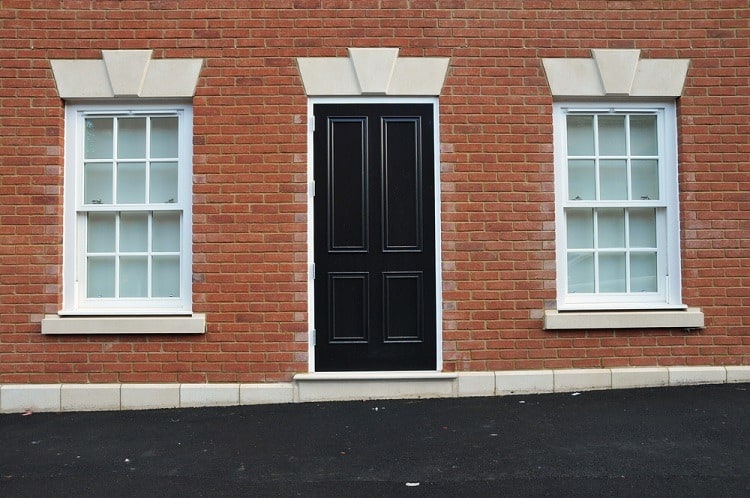 simple white exterior window trim for brick jomes