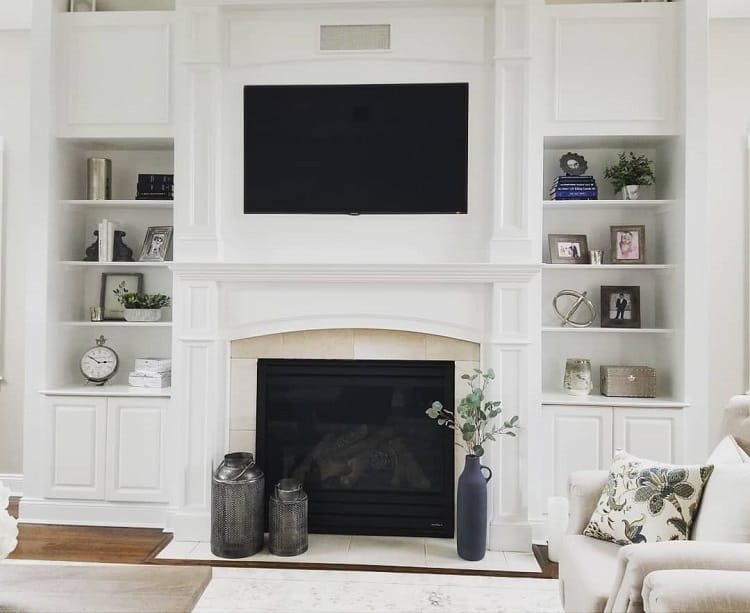 simple white fireplace recessed shelves