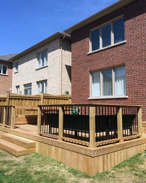 simple wood deck black balusters solid wood skirting