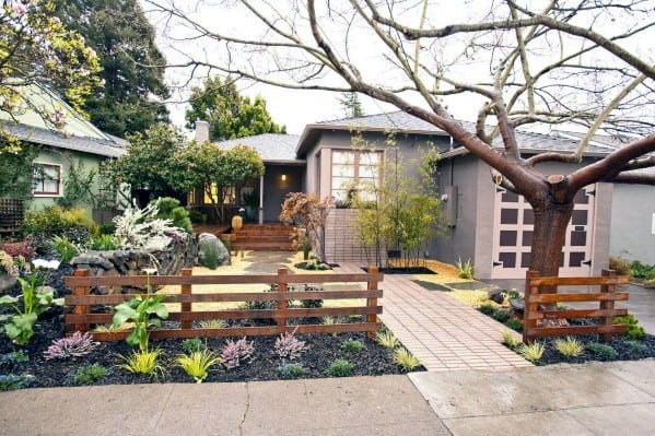 simple wood fence front yard gray house large tree