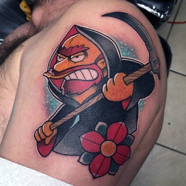 Bold tattoo of Groundskeeper Willie from The Simpsons as the Grim Reaper, gripping a scythe with a fierce expression.