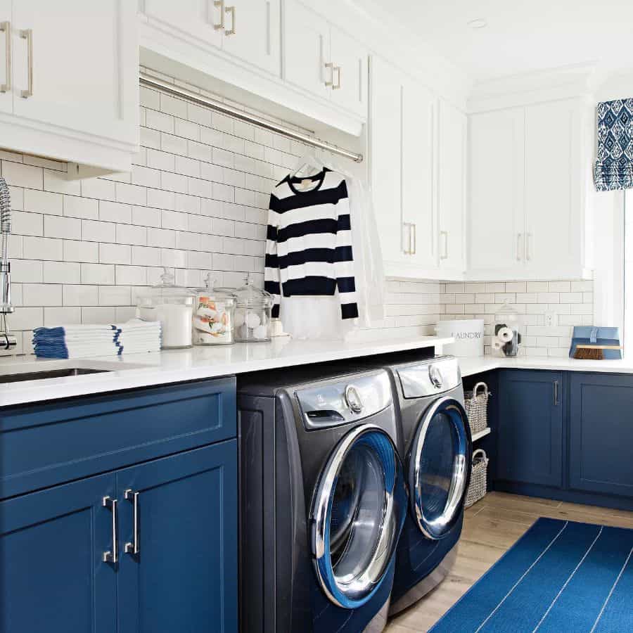 white and blue cabinet laundry white tile wall