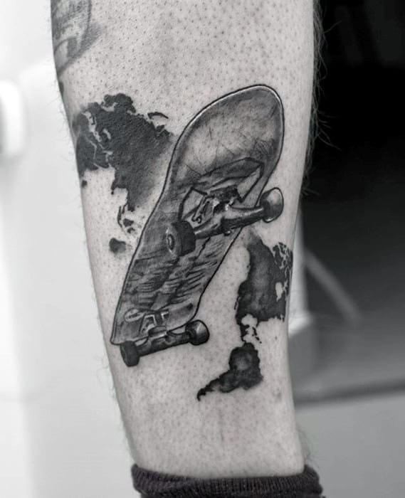 Black and grey tattoo of a skateboard over a world map silhouette, symbolizing global passion for skateboarding and travel.