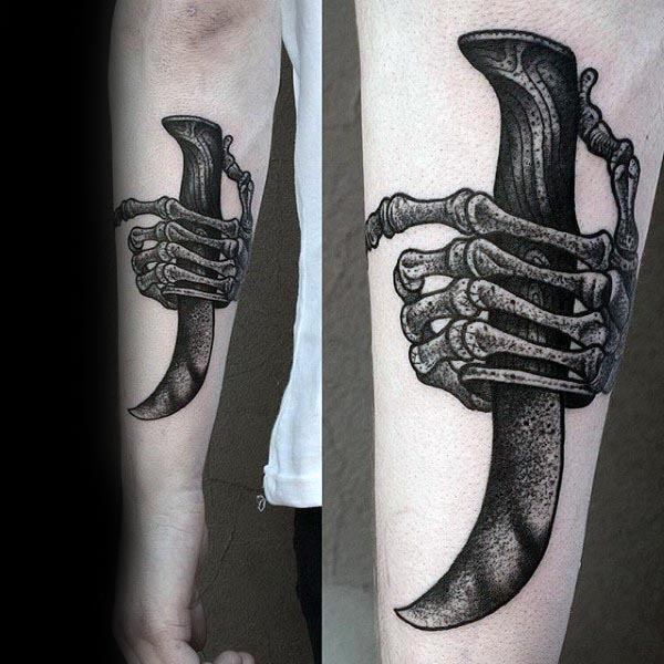 Skeleton Hand Bones Holding Dagger Mens Forearm Tattoo