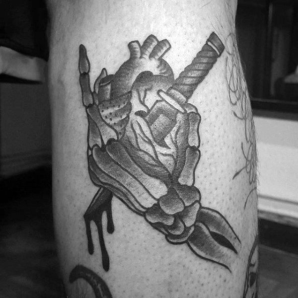 Skeleton Hand Heart And Dagger Tattoo Design Ideas On Back Of Leg