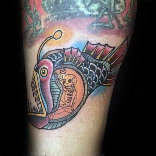 Skeleton Inside Angler Fish Tattoo Design On Man