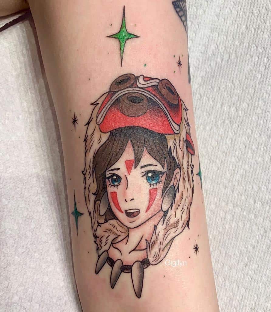Colorful tattoo of a girl with a wolf mask, adorned with red tribal markings on her face, blue eyes, and a necklace of teeth. The design is enhanced with stars and vibrant accents, giving the tattoo a bold and playful look.