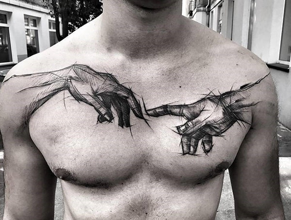 Sketch-style tattoo across the chest featuring two hands reaching towards each other, inspired by Michelangelo’s *Creation of Adam*, with fine, artistic linework.