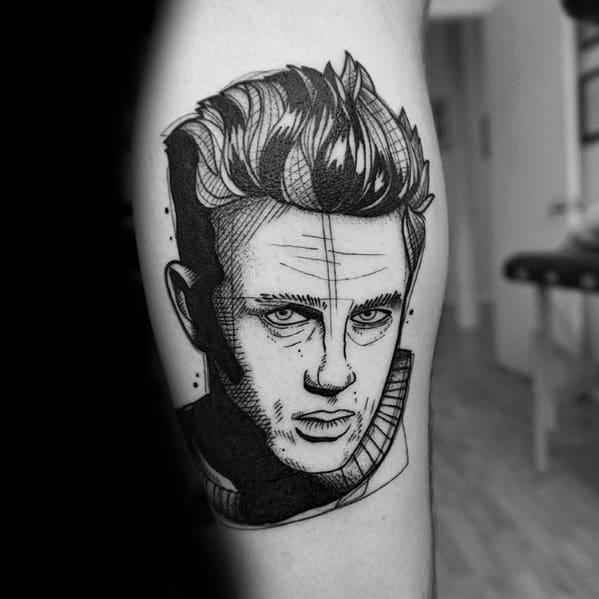 Bold black linework tattoo of James Dean with a stylized, sketch-like finish and cross-hatching details for a modern illustrative look.