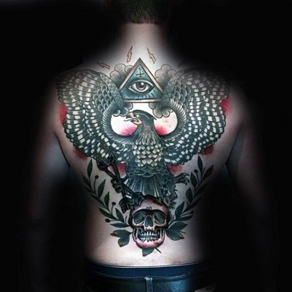Symbolic back tattoo featuring an all-seeing eye within a triangle, an eagle with spread wings, and a skull surrounded by leaves and roses.