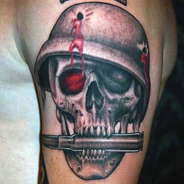 Skull Bite The Bullet Tattoo For Men On Upper Arm