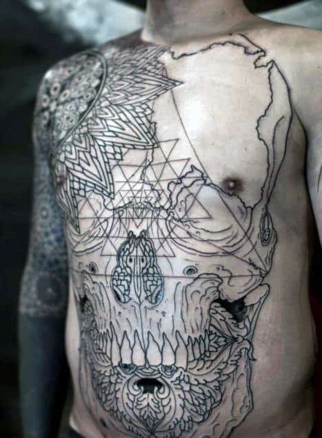 Man with intricate geometric and animal skull tattoos on chest and arm