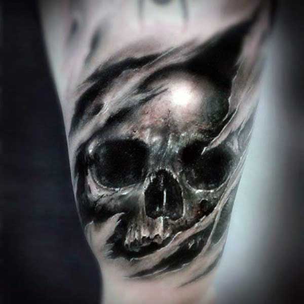 Skull Ripping Through Skin Tattoo On Arm