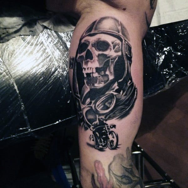 Skull Tattooed Biker On Bicep Of Mans Arm