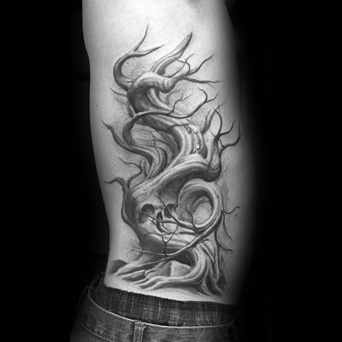 Surreal side tattoo of a twisted, flowing tree with branches that subtly form a skull, merging nature and dark fantasy elements.