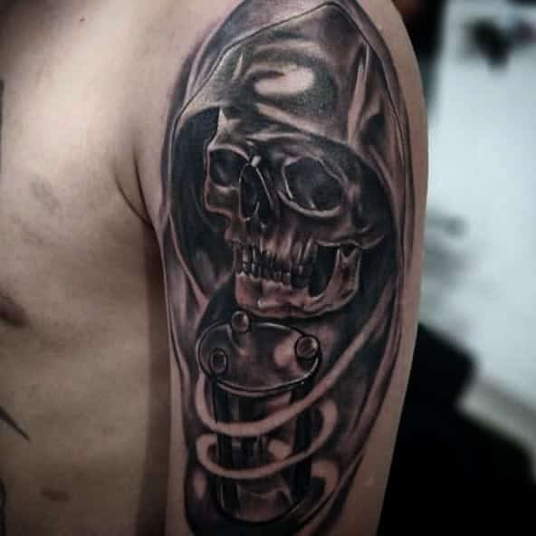 Tattoo of a hooded skull with a mechanical element on a person's arm