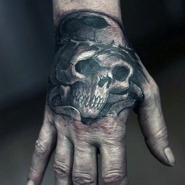 Skull With Crown Of Thorns Mens Hand Tattoo