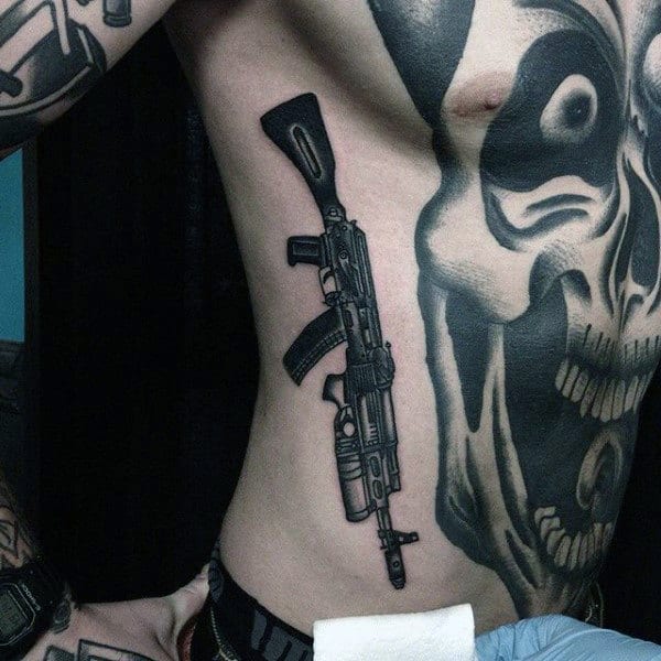 Skull With Firearm Insane Mens Ribs And Chest Tattoos