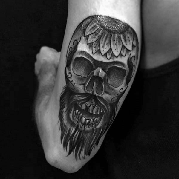 Skull With Flower And Beard Male Back Of Arm Tattoo