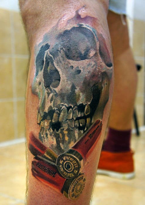Skull With Shotgun Shells Bullet Tattoo Design On Mens Leg Calf