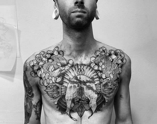 Skull With Snake And Chrysanthemum Upper Chest Tattoos For Gentlemen