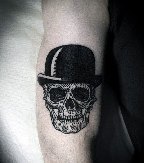 skull-with-top-hat-guys-woodcut-small-arm-tattoo