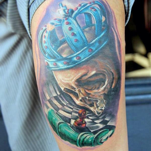 Skull With Turquoise Crown And Chessboard Tattoo Upperarms Male