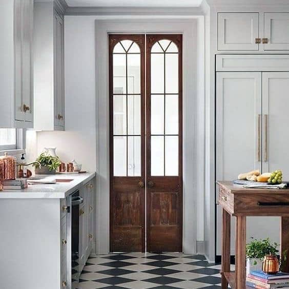 large narrow wood french door with glass windows 